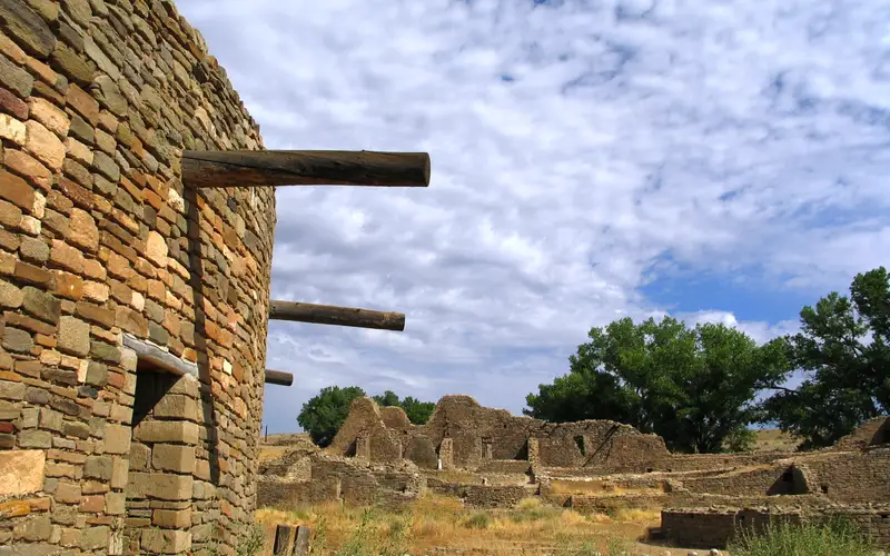Reconstructed stone kiva amidst stone ruins