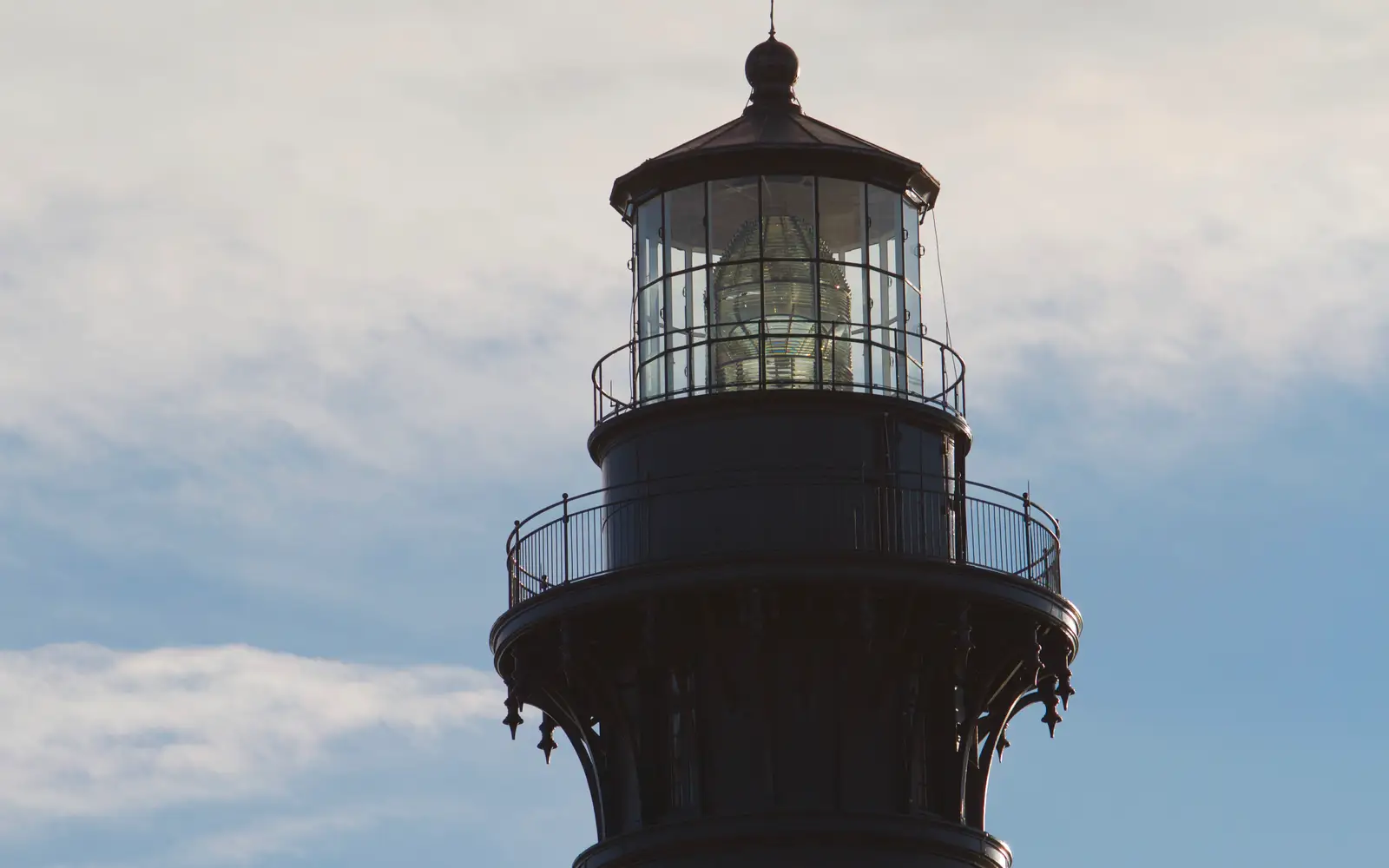 The first-order Fresnel lens is visible in the lantern room of the Bodie Island Lighthouse.