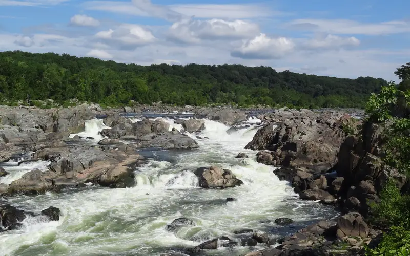 The rushing river cascades over the rocks of the Potomac