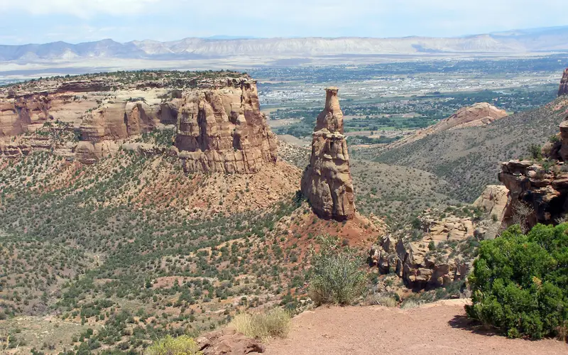 View of Independence Monument with Grand Valley in background. Taken from Rim Rock Rock Drive.