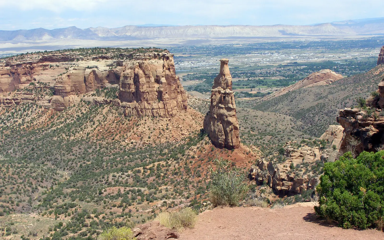 View of Independence Monument with Grand Valley in background. Taken from Rim Rock Rock Drive.