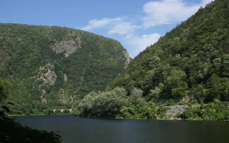 View of the Delaware River cutting between two low mountain peaks