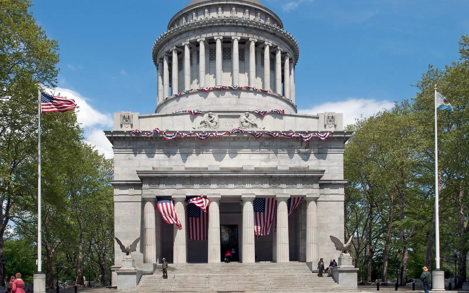 Mausoleum and flags in sunny weather