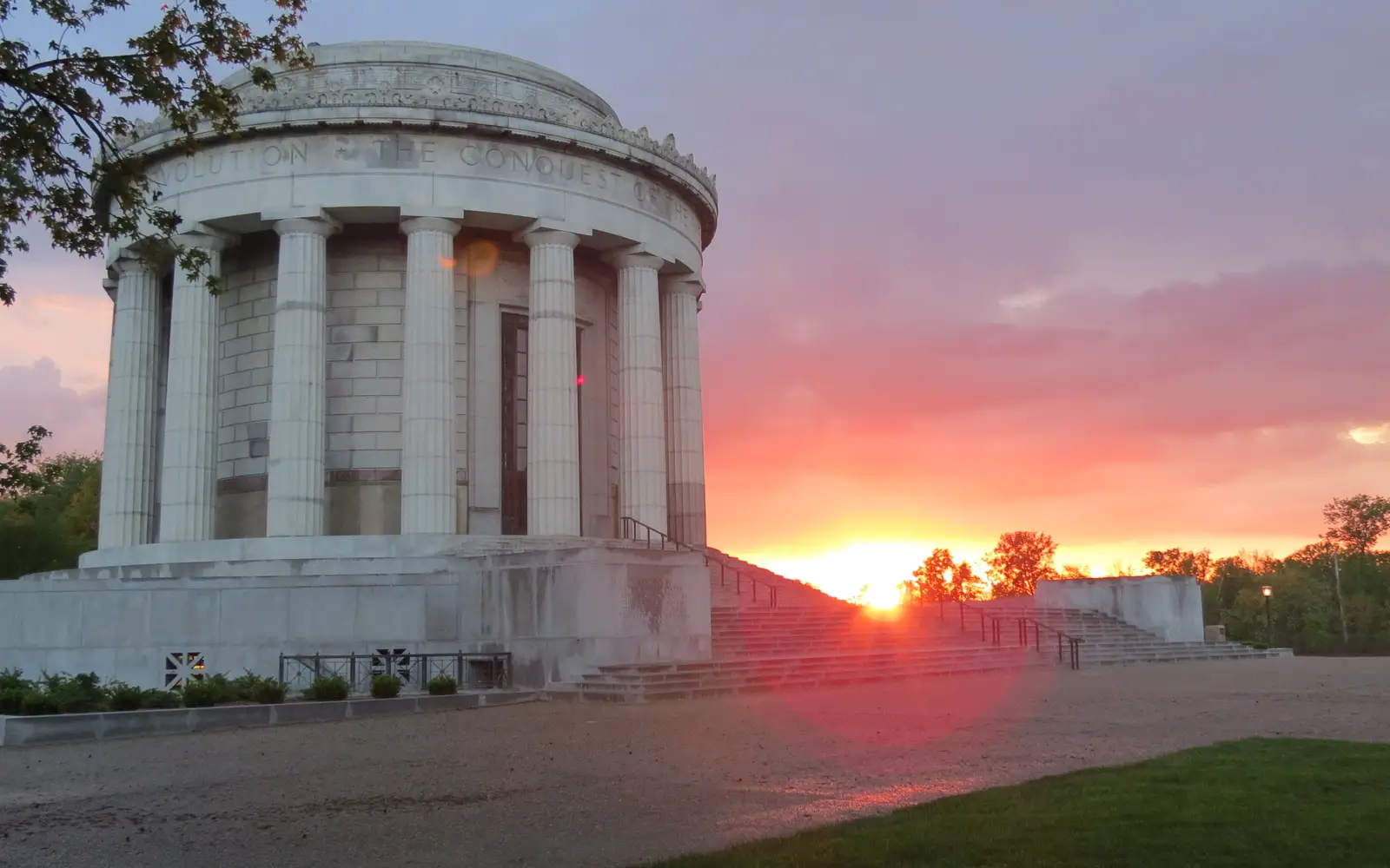 Sun setting behind the Clark Memorial