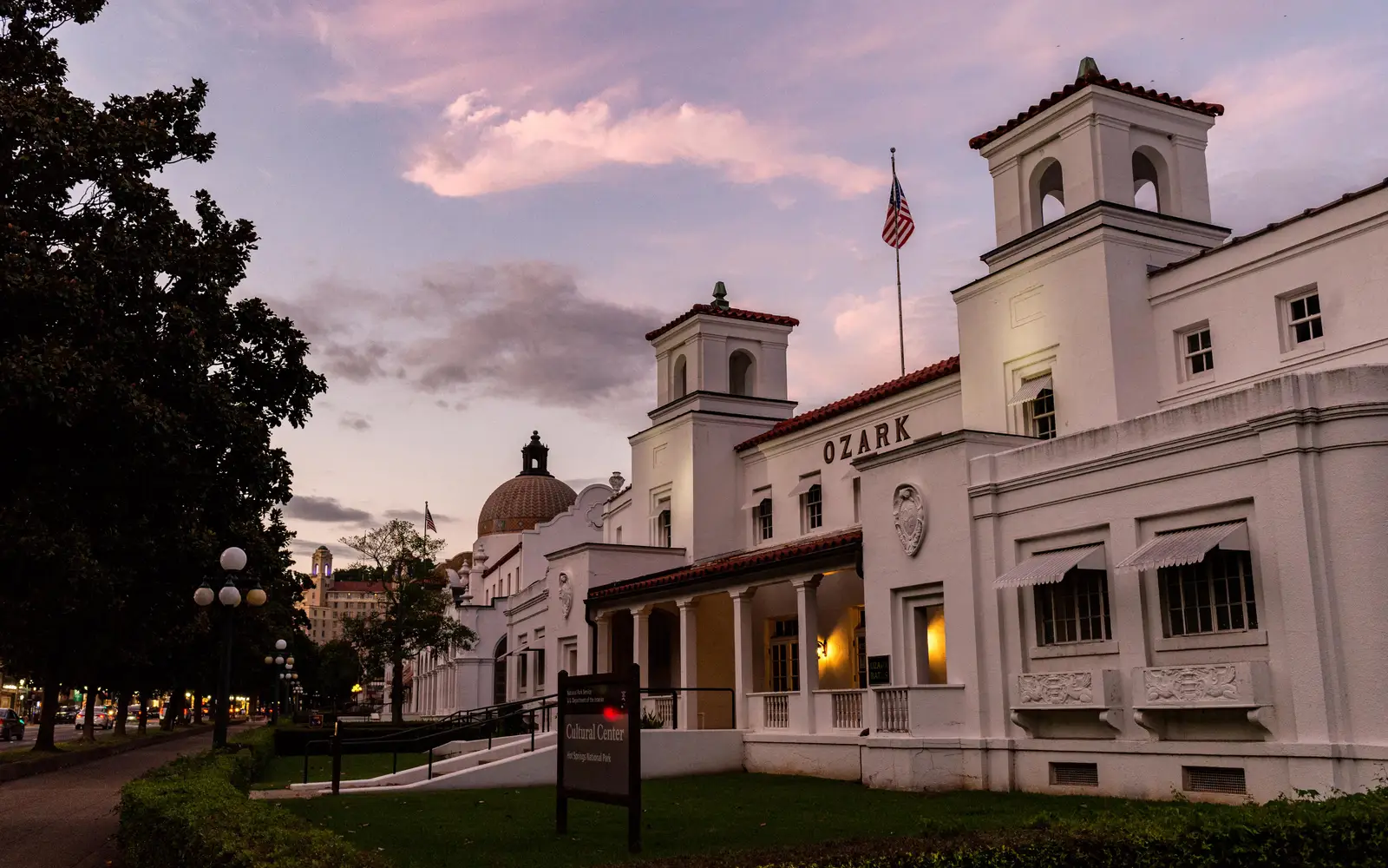 A pink sky above gentle white buildings