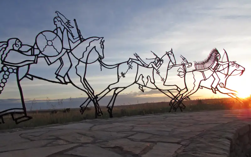 The sun sets behind the Indian Memorial.