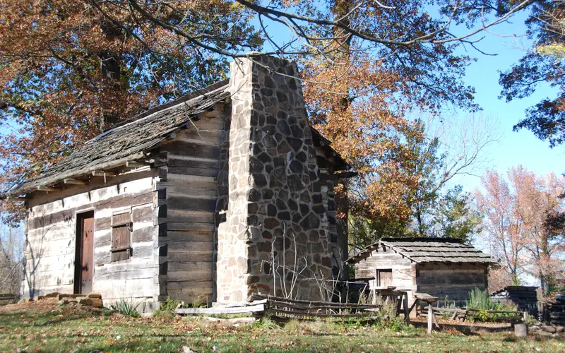 Cabin and smokehouse in the fall