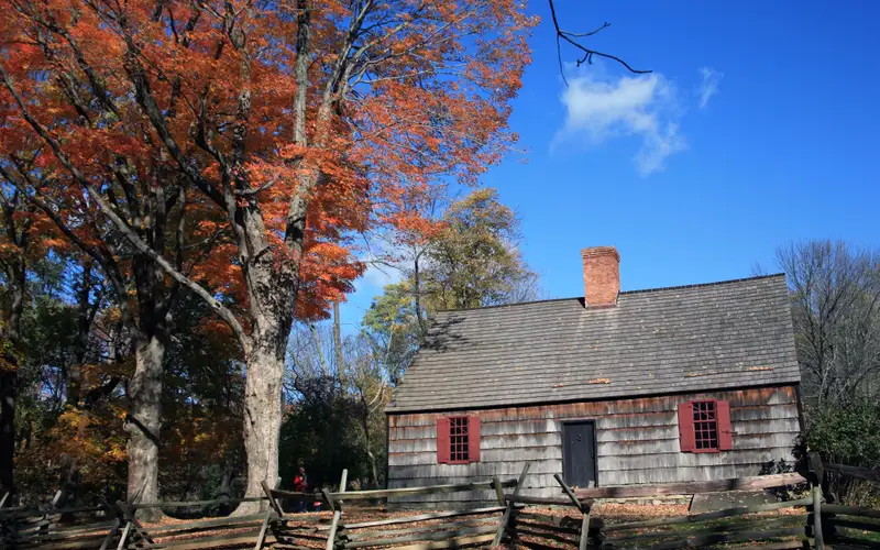 The Wick House surrounded by colorful fall leaves