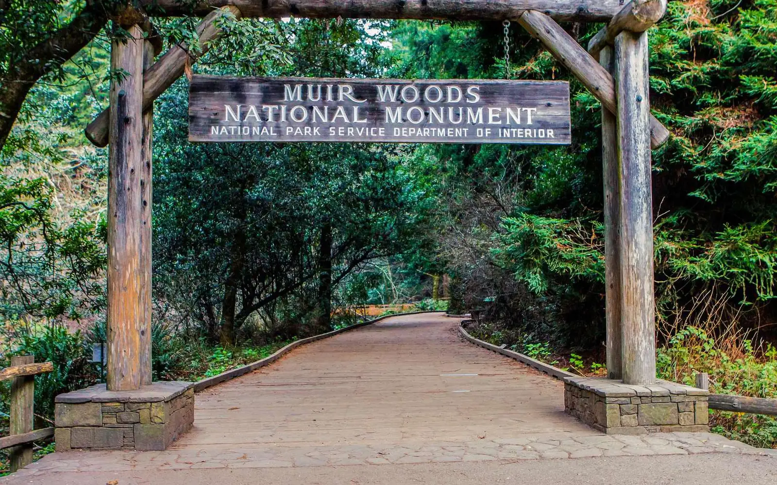 Wooden sign and entrance to Muir Woods National Monument