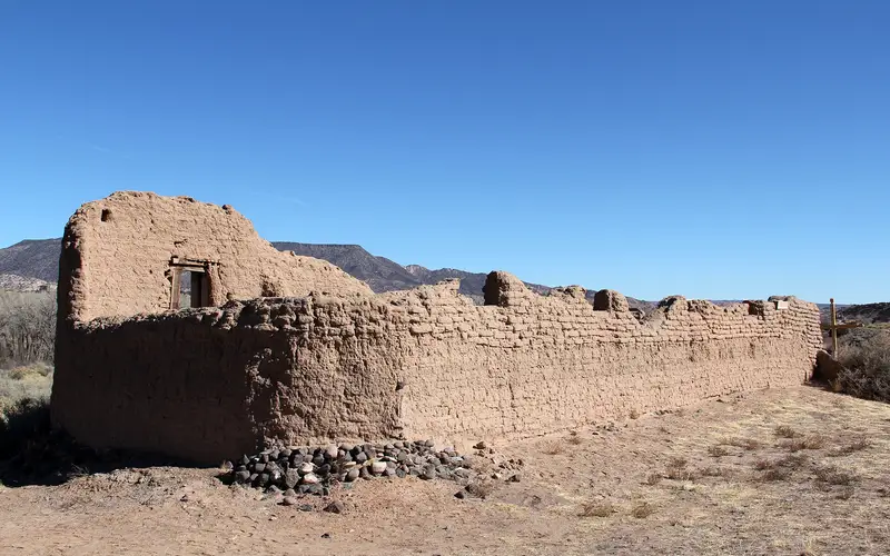 crumbling adobe structure with blue sky