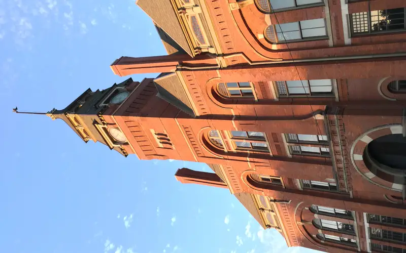 front of clocktower taken looking up with blue sky, sunny