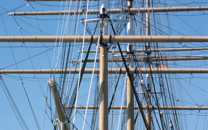 The bow and masts of a 19th century sailing ship.