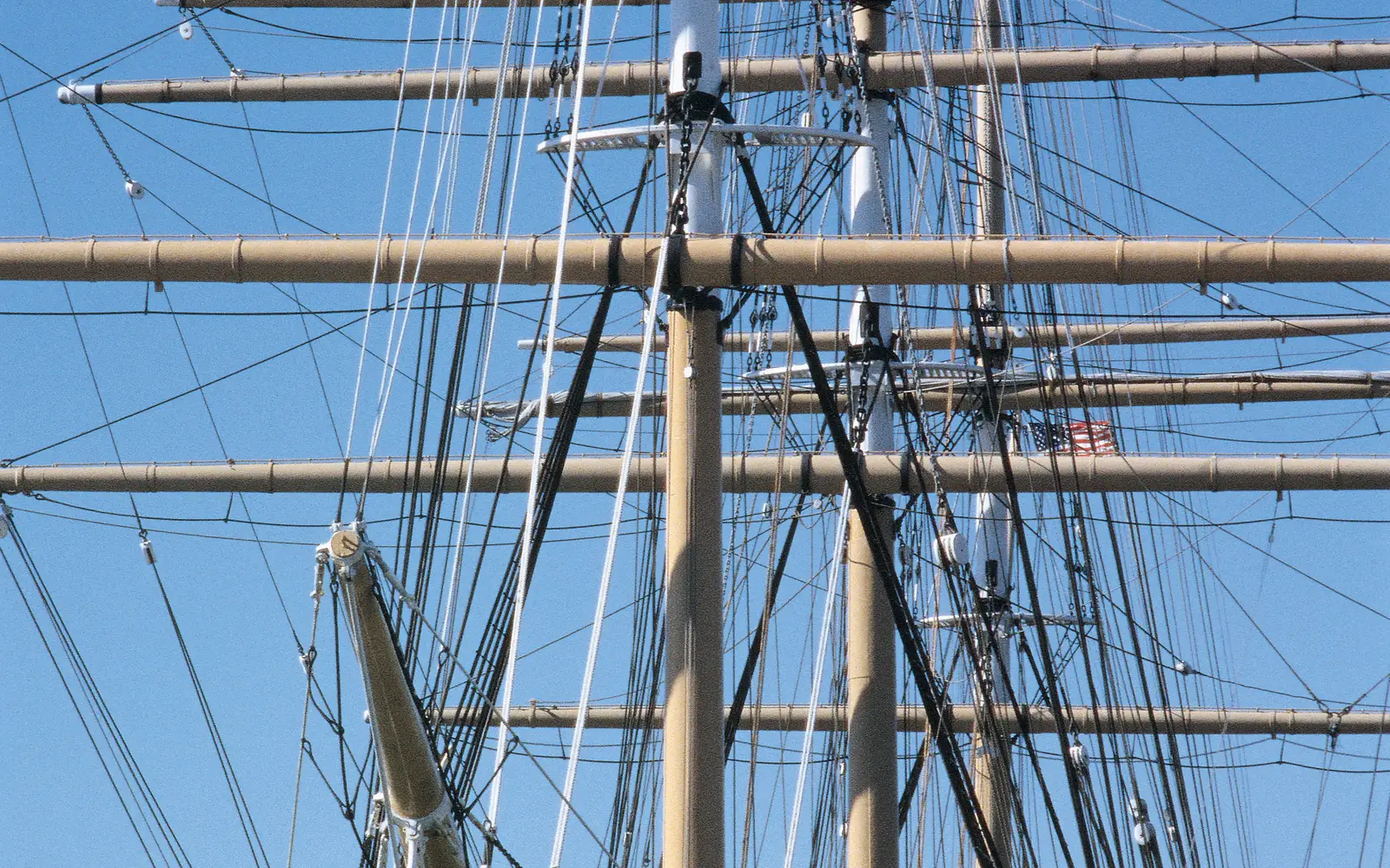 The bow and masts of a 19th century sailing ship.