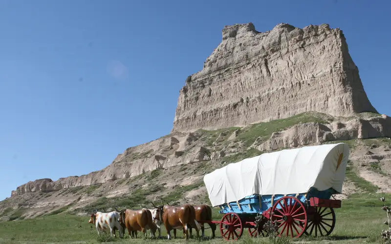 Conestoga wagon in front of Eagle Rock